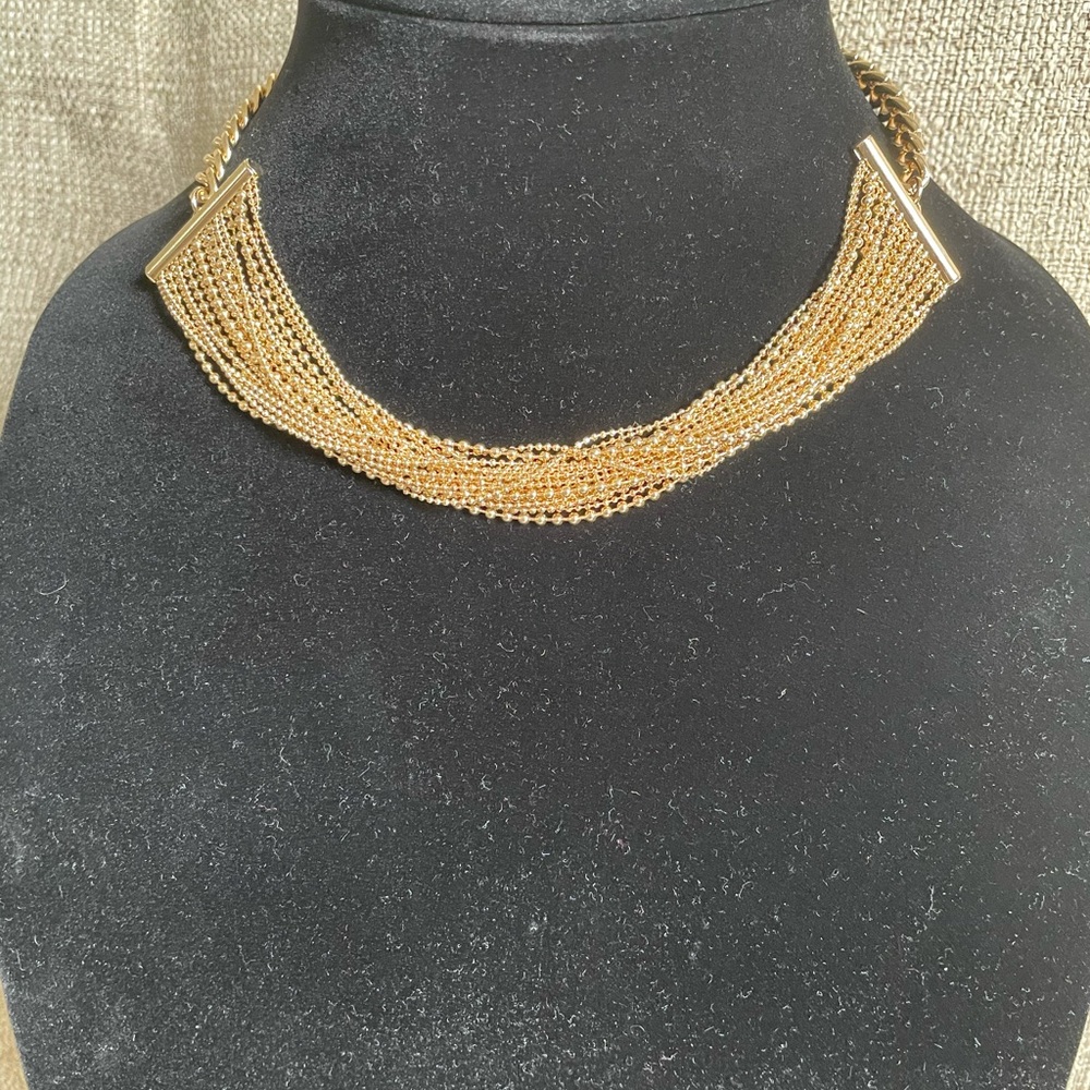 Gold beaded choker.